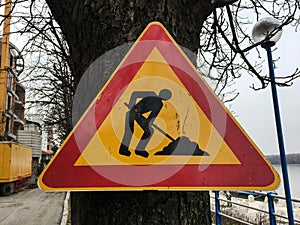 Road repair sign. Street road under construction. Road signs on the roadside along the road warning about the repair.