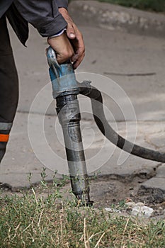 Road repairing works with jackhammer