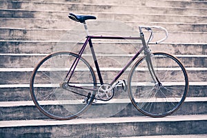 Road retro bicycle and concrete stairs, urban scene vintage style