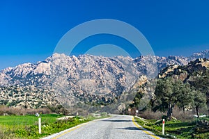 Road and  rock detail from Latmos Besparmak Mountain. Milas, Aydin, Turkey