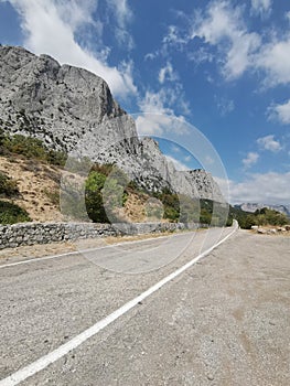 The road at the rocks of the Crimea on the southern shore