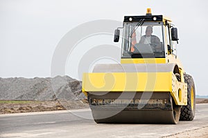 Road roller during asphalt paving works