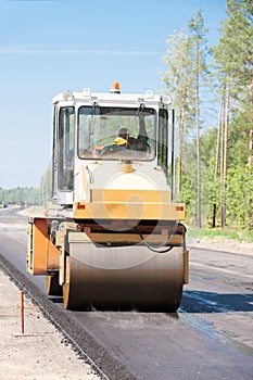 Road roller compact asphalt during road works