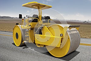 Road roller compacting asphalt