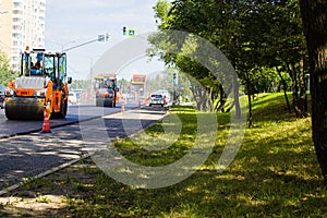 Road roller flattens the asphalt on the new road