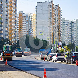 Road roller flattens the asphalt on the new road