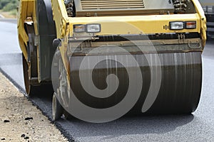 Road roller makes the paving