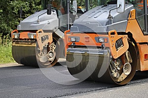 Road roller makes the paving