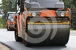 Road roller makes the paving