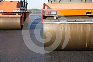 Road rollers during asphalt compaction works