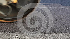 Road rollers leveling fresh asphalt pavement