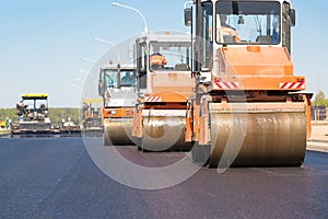 Road rollers machines compacting fresh asphalt