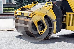 Road rollers paving a road