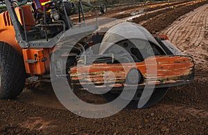 Road rollers working on the new roads construction site. Heavy duty machinery working on highway. Construction equipment