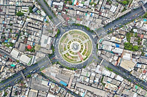 Road roundabout with car lots Wongwian Yai in Bangkok,Thailand. street large beautiful downtown at evening light. Aerial view ,