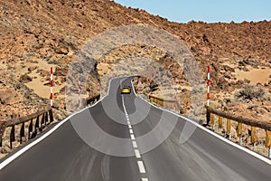 Road running through arid volcanic wasteland On Tenerife.