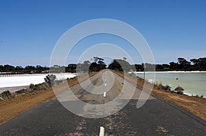 Road through the salt lakes between Hyden and Albany, WA, Australia