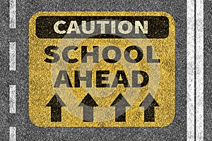 Road with School ahead caution sign
