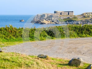 The road on the sea coast. Landscape on the Guernsey Island