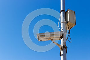 Road Security camera on blue sky background