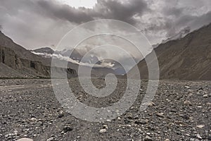 The road between Shimshal village 3100m and Upper Shimshal 5,680m runs through steep gorges on narrow paths and hollowed out i photo