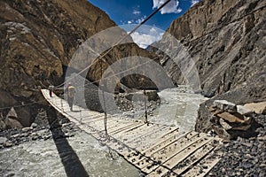 The road between Shimshal village 3100m and Upper Shimshal 5,680m runs through steep gorges on narrow paths and hollowed out i photo