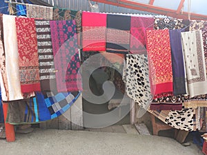 road side small souvenir shoppe in Patnitop selling traditional Kashmiri Shawls