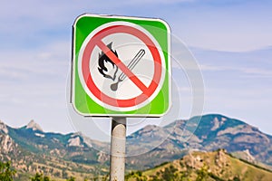 Road sign against the fire