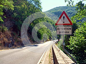 Road sign attention with sign attention pedestriansin the Ardennes of Luxembourg