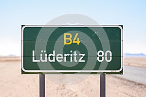 Road sign at the B4 road in Namibia, Africa, leading to the coastal town of LÃ¼deritz / Luderitz with 80 kilometers to go.