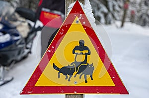 Road sign beware of sledge dog team