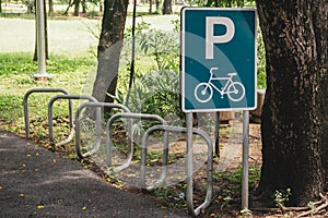 Road Sign, Bicycle parking symbol and bicycle parking rack , Bicycle park area sign in square frame in public park