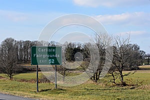 Road Sign for Carlisle Fairgrounds Exit off Interstate 81 South in Pennsylvania