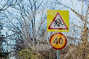 Road sign Caution children and speed limit 40