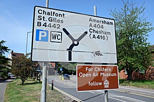 Road sign for Chalfont St. Giles B4442 and Amersham A404 and sign for the Chiltern Open Air Museum