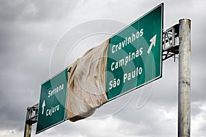 Road sign covered with a fabric