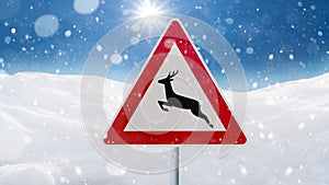 Road sign deer crossing in winter, warning sign