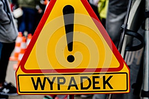 Road sign denoting an accident in Polish. Police road sign photo