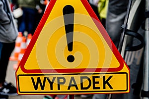 Road sign denoting an accident in Polish. Police road sign