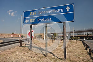 Road sign directions by car from or Tambo airport