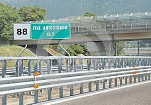 Road sign at end of motorway and the text Fine Autostrada that