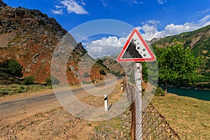 Road sign. Falling rocks. Uzbekistan, western Tien-Shan mountains.