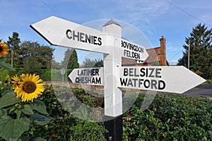 Road sign at Flaunden, Hertfordshire with directions to Latimer, Chesham, Bovingdon, Felden, Chenies, Belsize and Watford