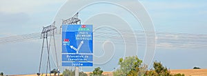 Road sign of the French highway with directions to reach European cities photo