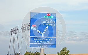 Road sign of the French highway with directions to reach European cities photo