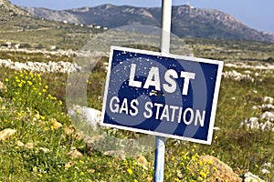 Road sign full of shotgun holes