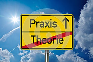 Road sign with the german words for practice and theory - Praxis und Theorie in front of a blue sky photo