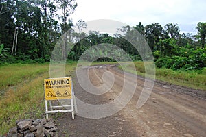 Road sign on haulage road in Papua New Guinea