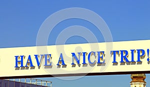 Road sign `Have a nice trip`.