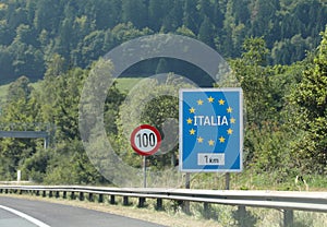 road sign on the highway on the border in Italy and the speed limit